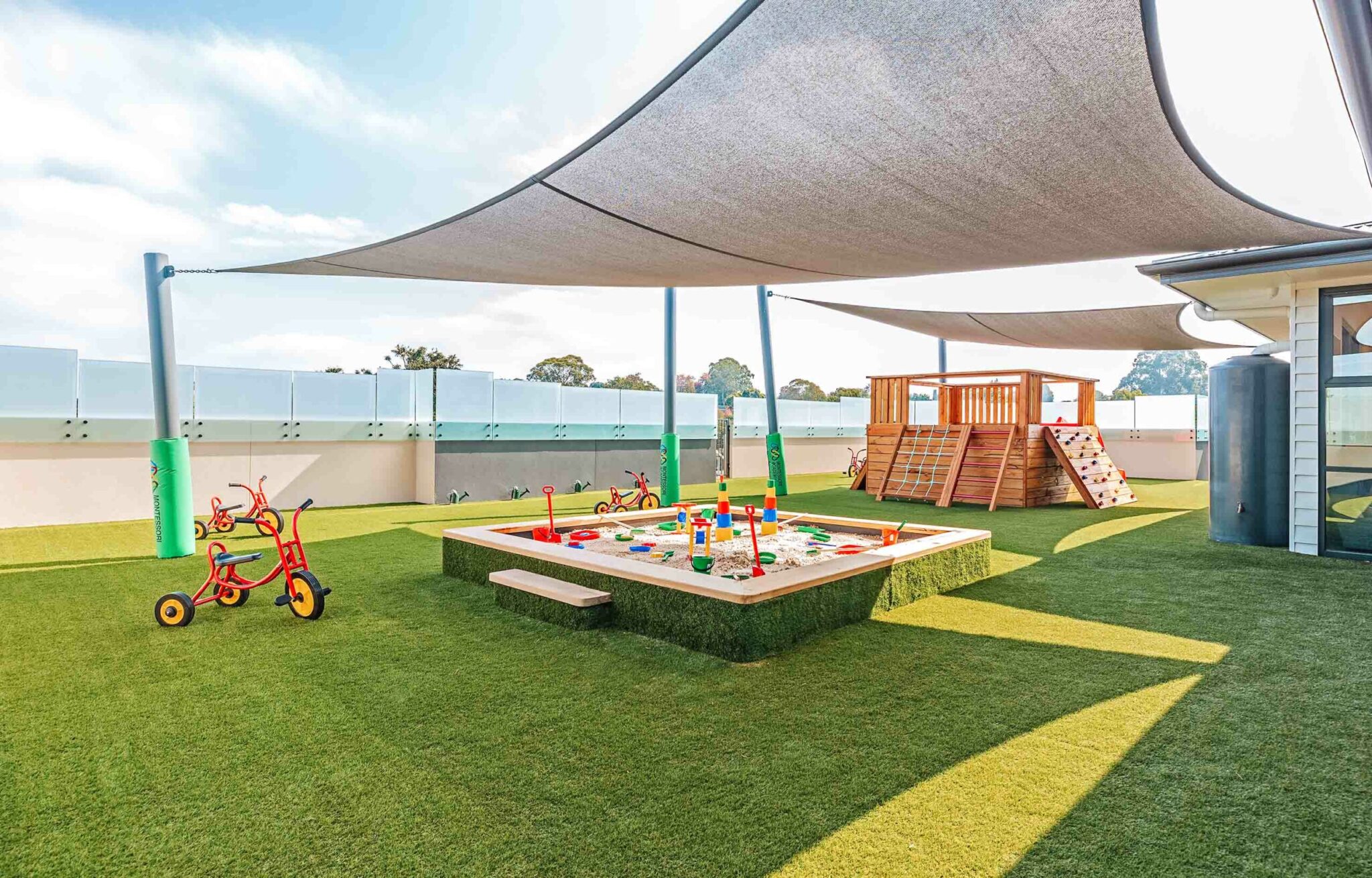 Childcare Outdoor Area with play equipment and sandpit