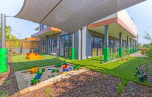 Childcare Outdoor Playground Area with Sandpit and Shade Sails
