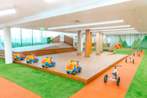 Childcare Outdoor Simulated Outdoor Area with bike track and tricycles.