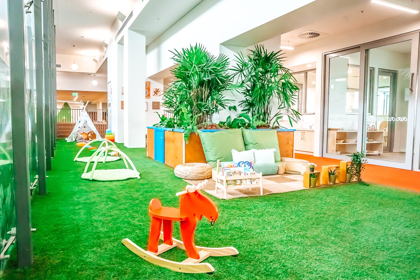 Childcare outdoor simulated area with rocking chair and cosy reading nook