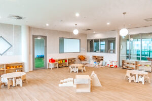 Childcare infant classroom with Montessori materials and climbing frame