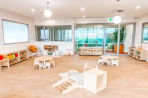 Childcare infant classroom with Montessori materials and climbing frame