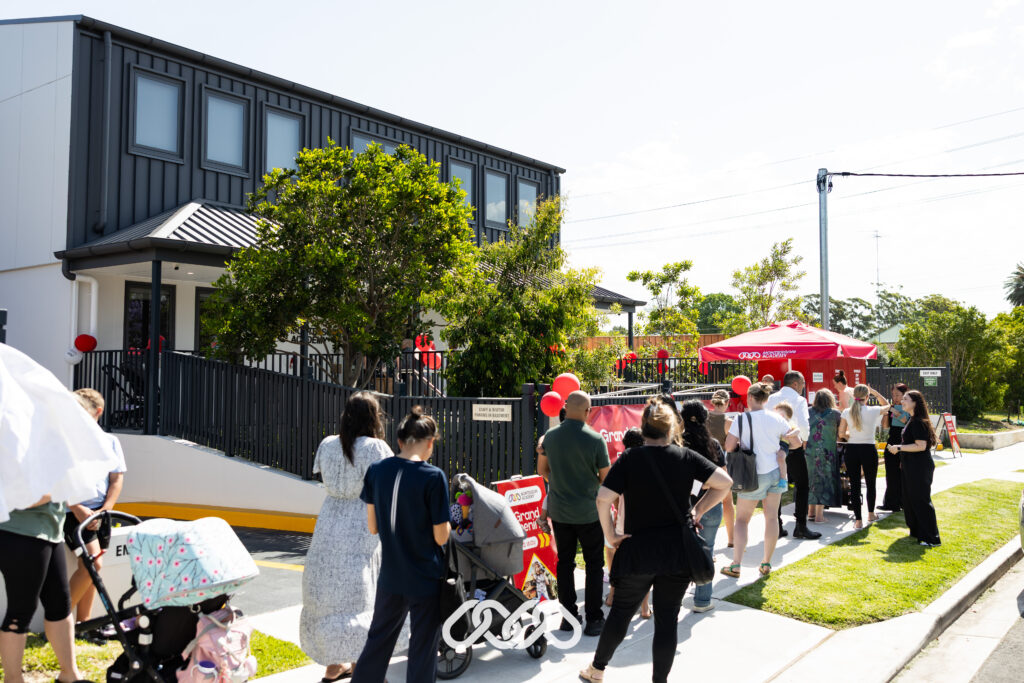 Families lining up to enter the Penrith Derby Street grand opening event outside the centre.